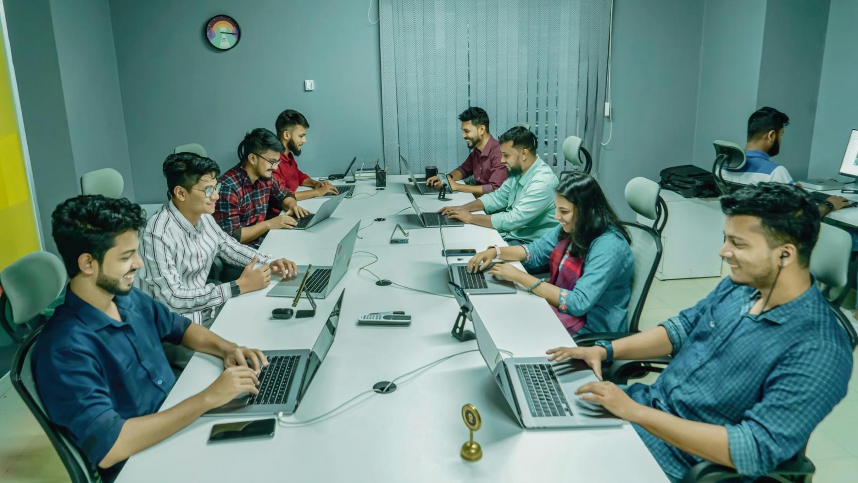 Students working on operational budgeting exercises in collaborative learning environment